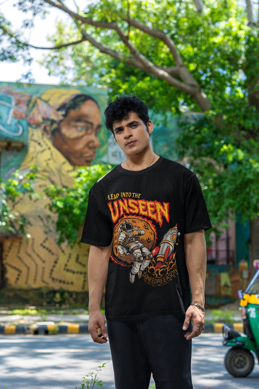Oversized White T-Shirt with Astronaut & Rocket Graphic – Leap into the Unseen Streetwear Tee.